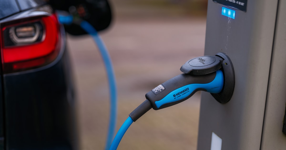 Electric vehicle plugged into a public charging point